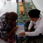 Warga Binaan mengikuti bimbingan bacaan Al-Qur'an